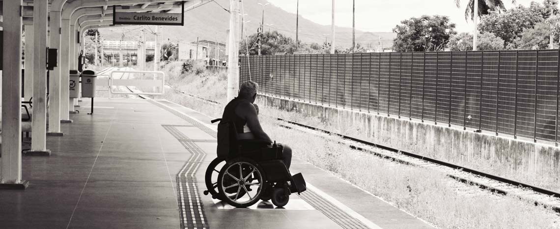 Person waiting for a train in a wheelchair